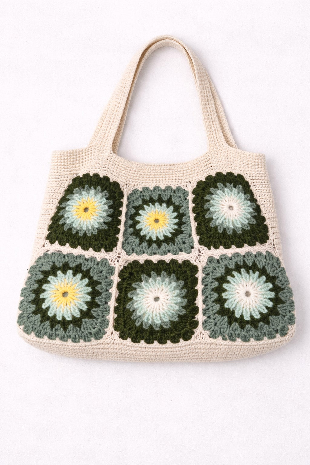 Crocheted tote bag with a floral pattern on a white background