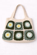 Crocheted tote bag with a floral pattern on a white background
